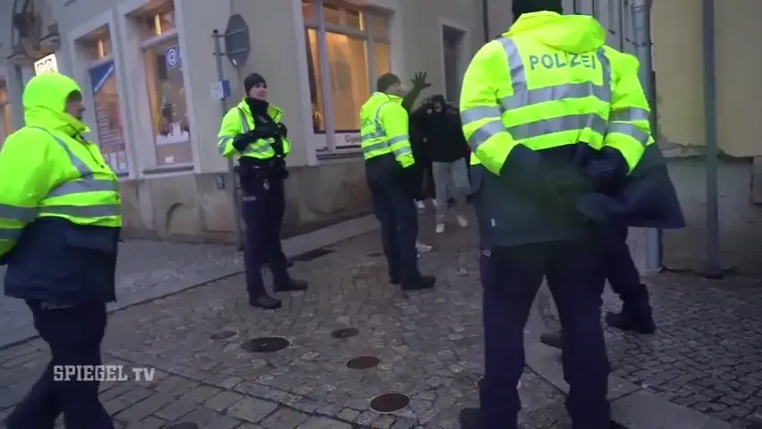 Showing the Nazi Salute infront of German Police