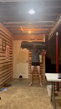 Squatting with a punching bag, possibly worst form ever. Thoughts?