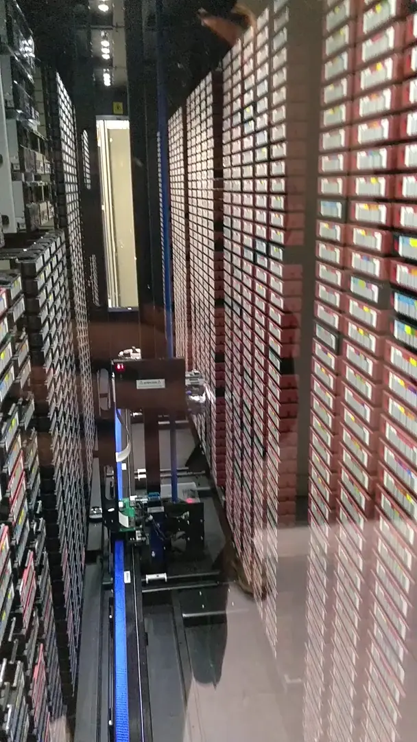 The robot managing my university's backup. Each of those barcoded cassettes on the right is a 12 Terabyte magnetic tape