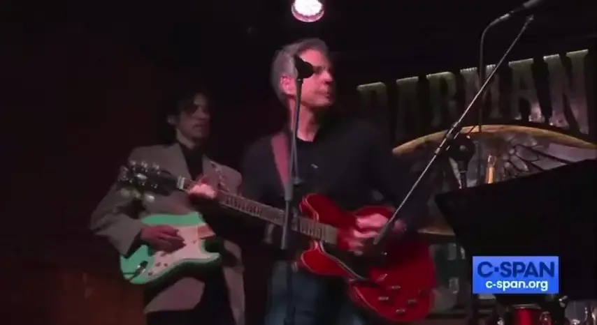 U.S. Secretary of State Antony Blinken performs “Rocking to the Free World” in a bar in Ukraine after delivering billions of dollars of weapons