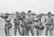 Vietnam War. Pleiku. July 1970. Australian Army Training Team Vietnam (AATTV) adviser WO2 Jim Calcutt (centre), training Montagnard soldiers at the 2nd Mobile Strike Force {MIKE Force) base in central South Vietnam. He is teaching the soldiers how to use the M79 grenade launcher. [640 x 442]