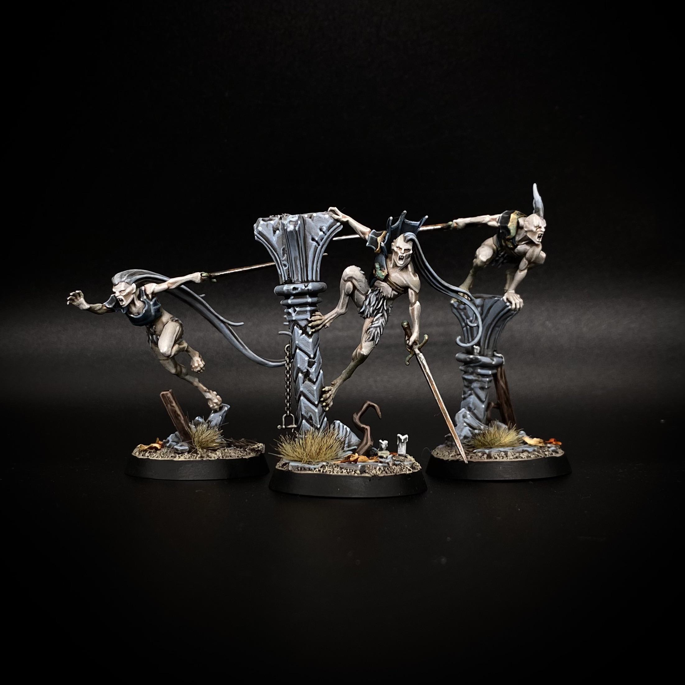 Vyrkos Blood-born Warhammer miniatures with spears and pillars against a black background
