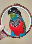 Wanted to share my new crimson bellied conure sculpture. His body is covered with several hundred handmade feathers. It is made entirely of EVA foam.