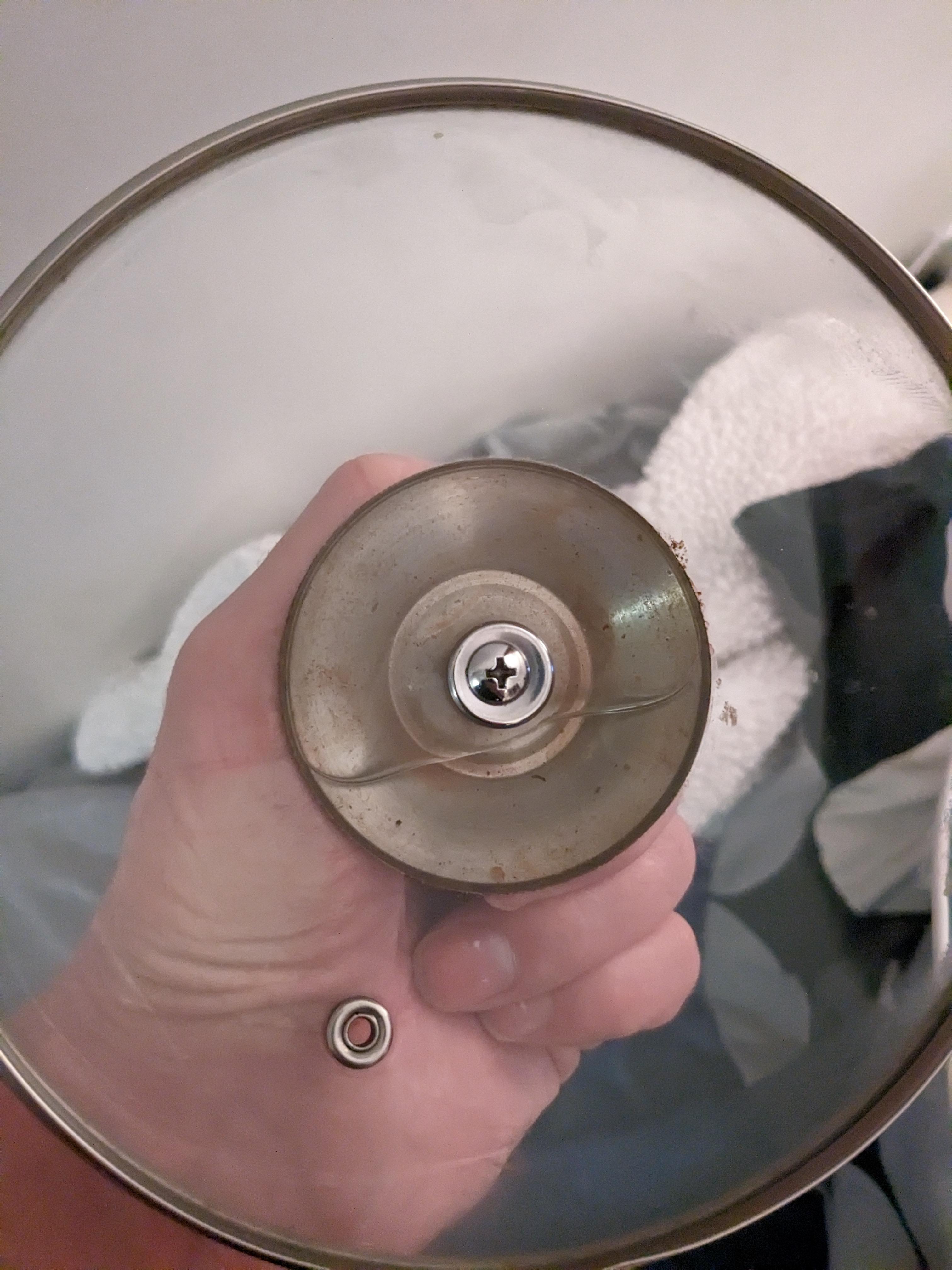 Water gets stuck inside pot lid from steam that won't come out
