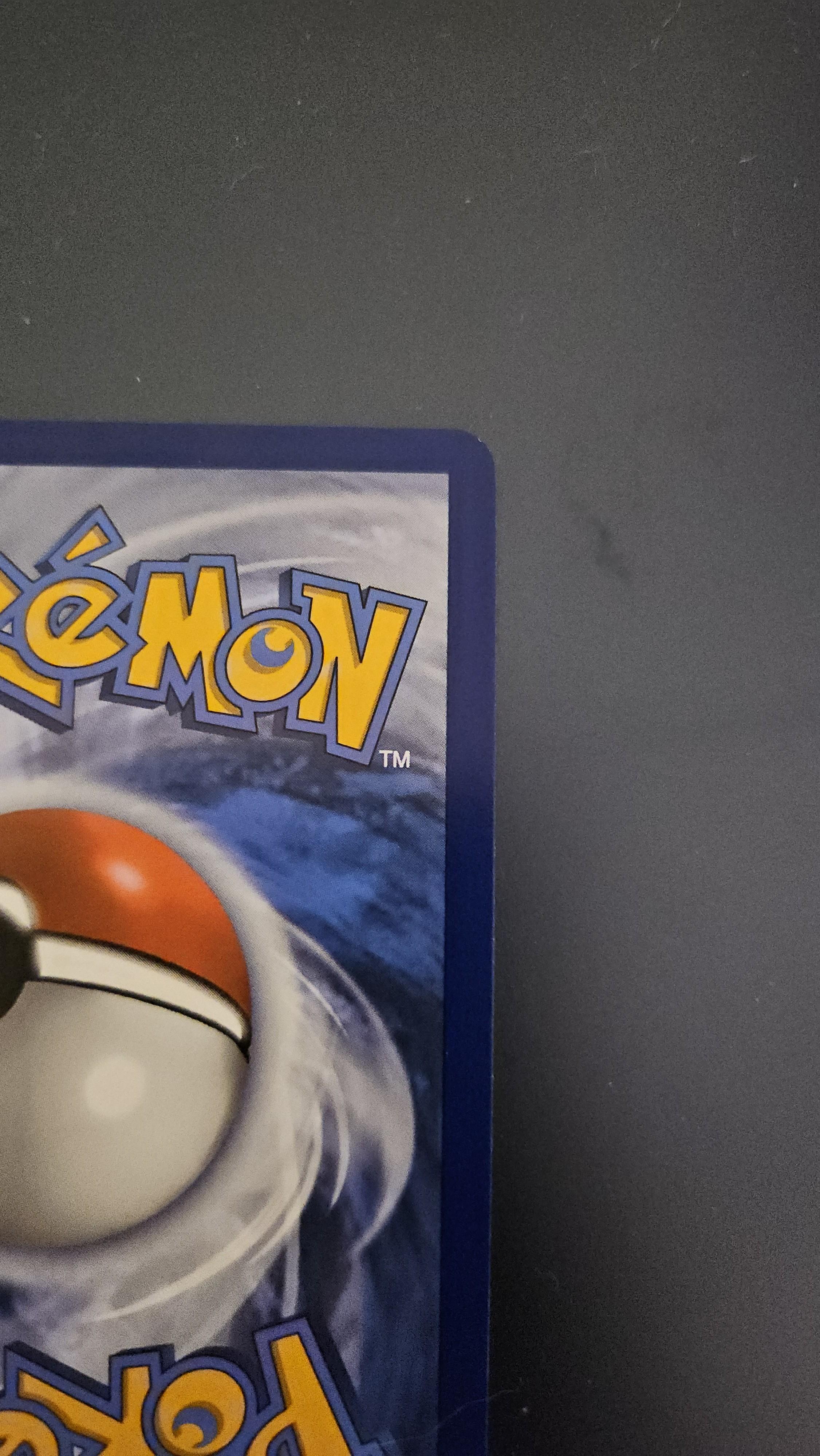 Charizard Pokémon card front and back on a dark surface