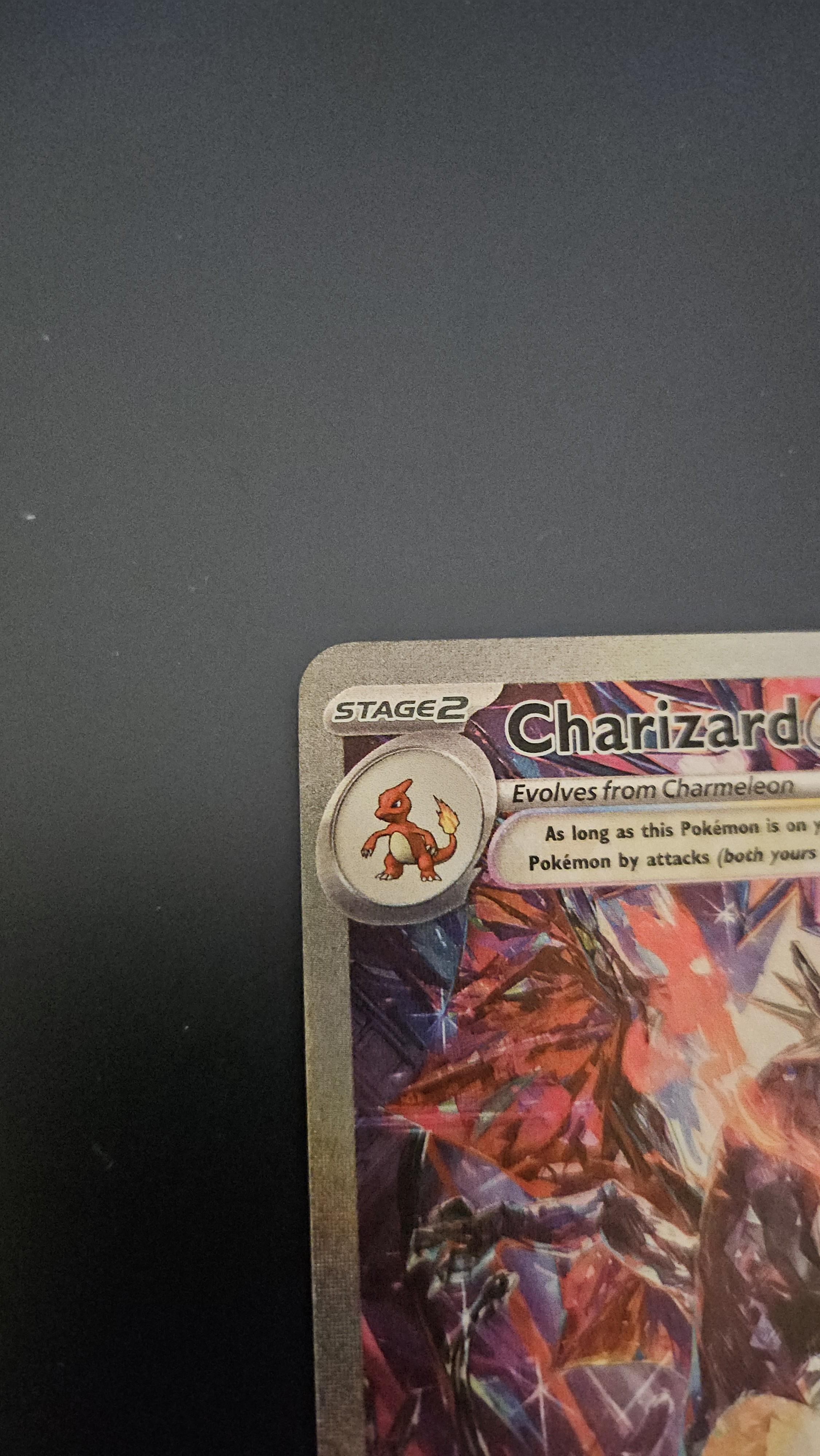 Charizard Pokémon card front and back on a dark surface