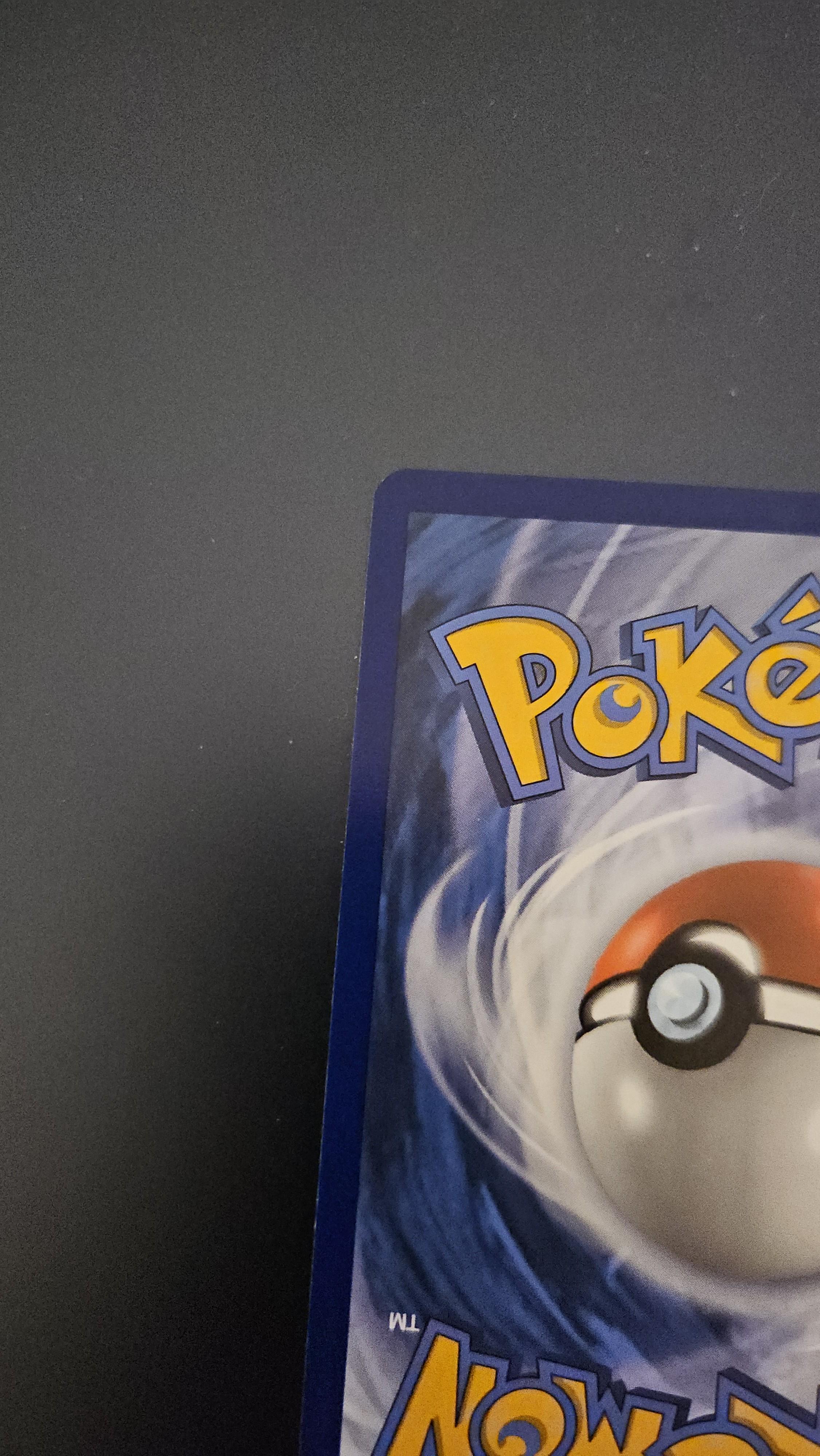Charizard Pokémon card front and back on a dark surface