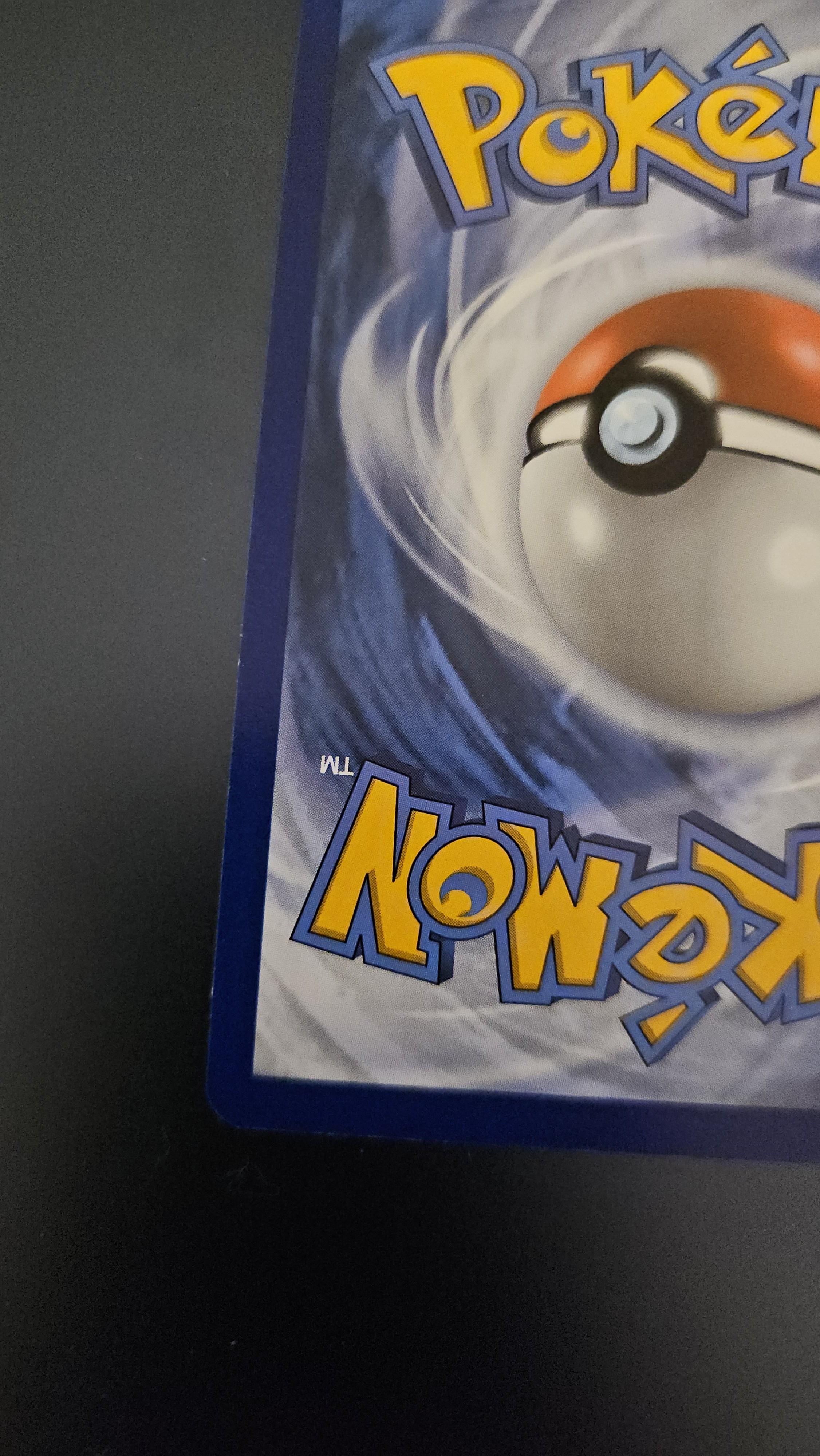 Charizard Pokémon card front and back on a dark surface