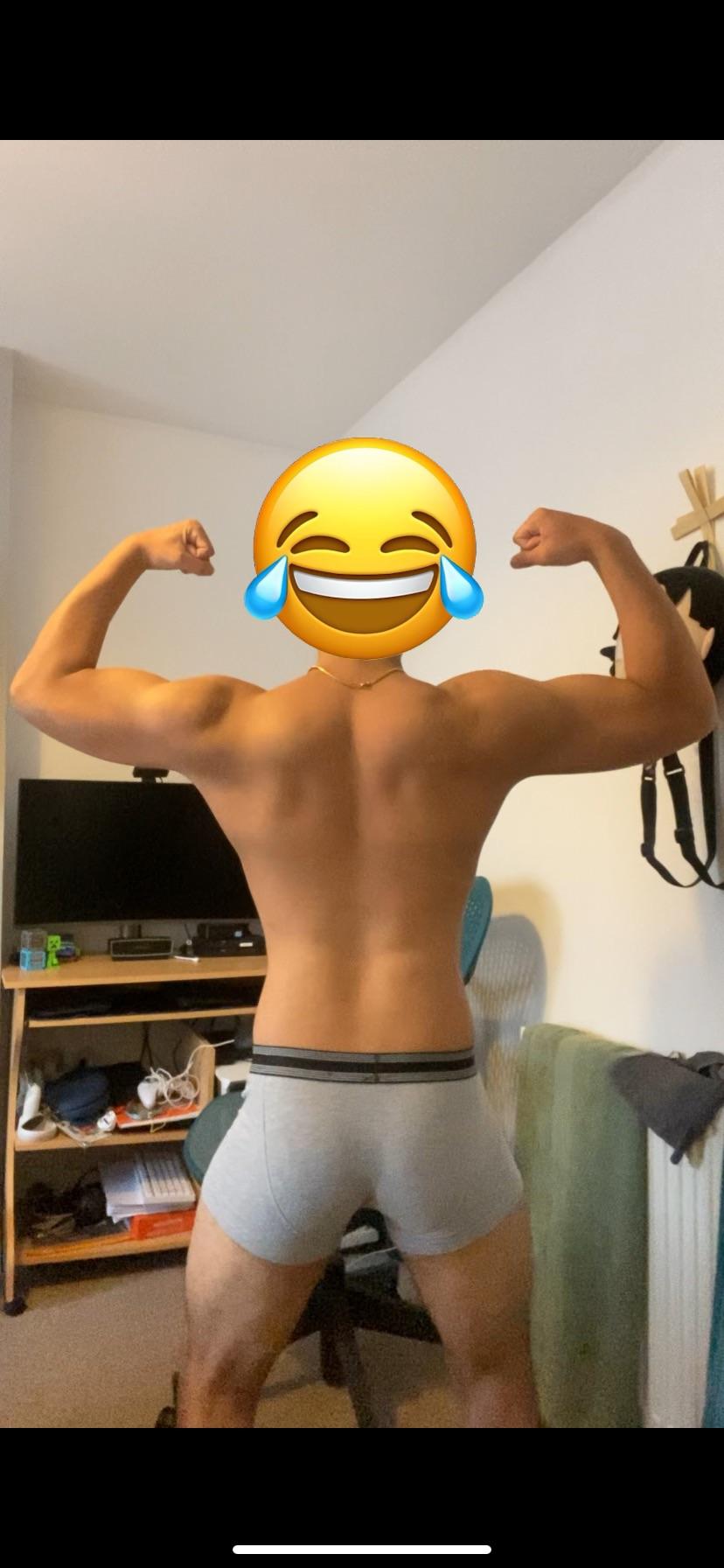 Muscular tan man in underwear posing for bodybuilding and fitness bodyshots