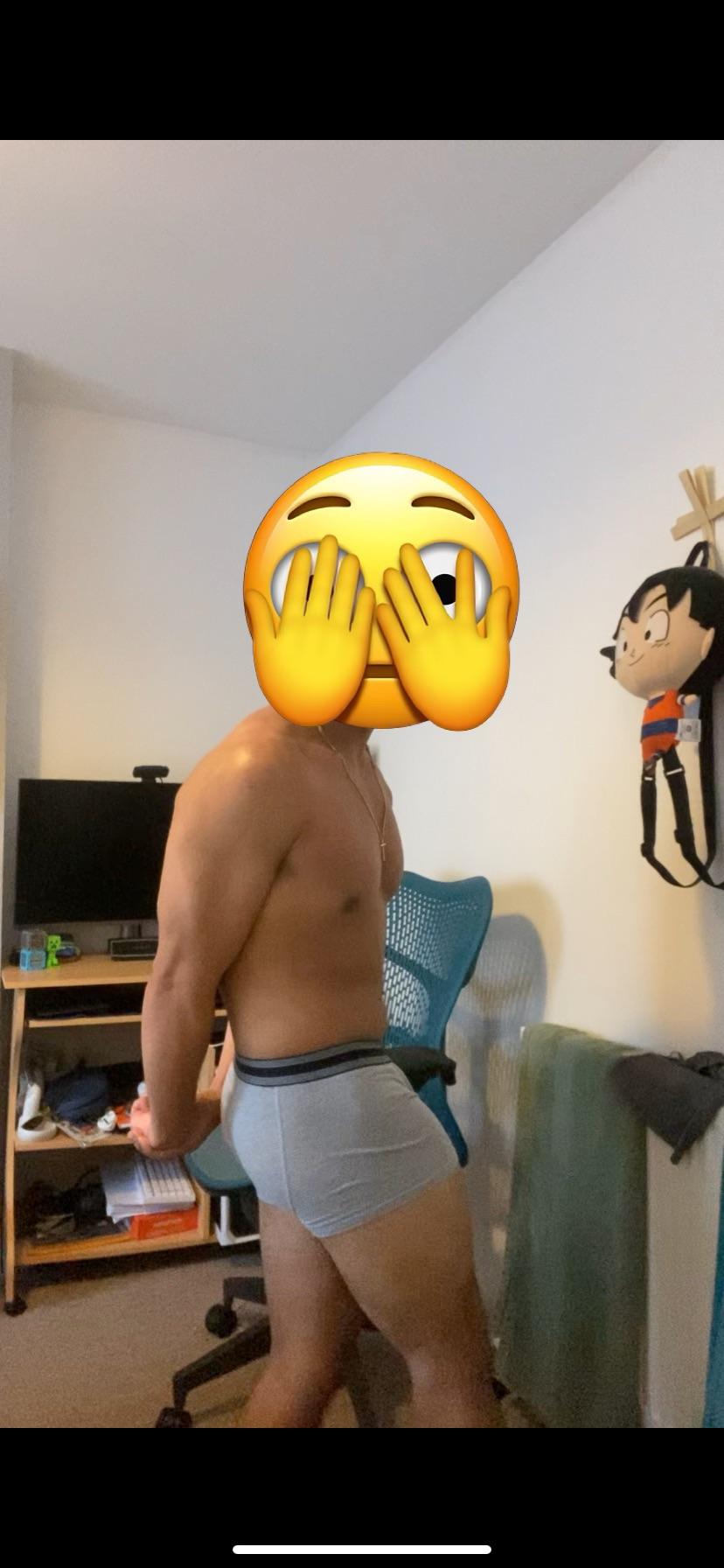 Muscular tan man in underwear posing for bodybuilding and fitness bodyshots