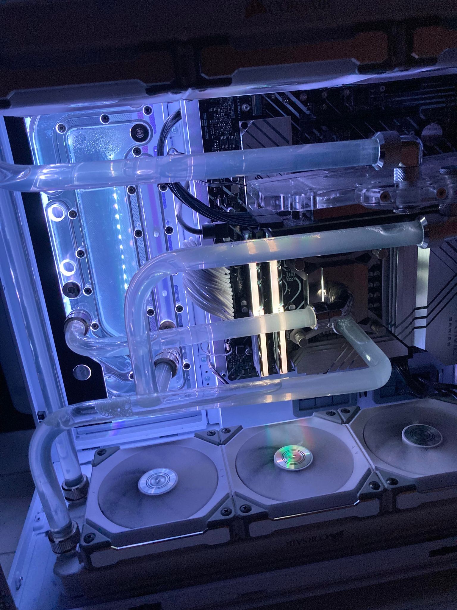 Custom gaming pc build with blue lighting and liquid cooling hardtubes