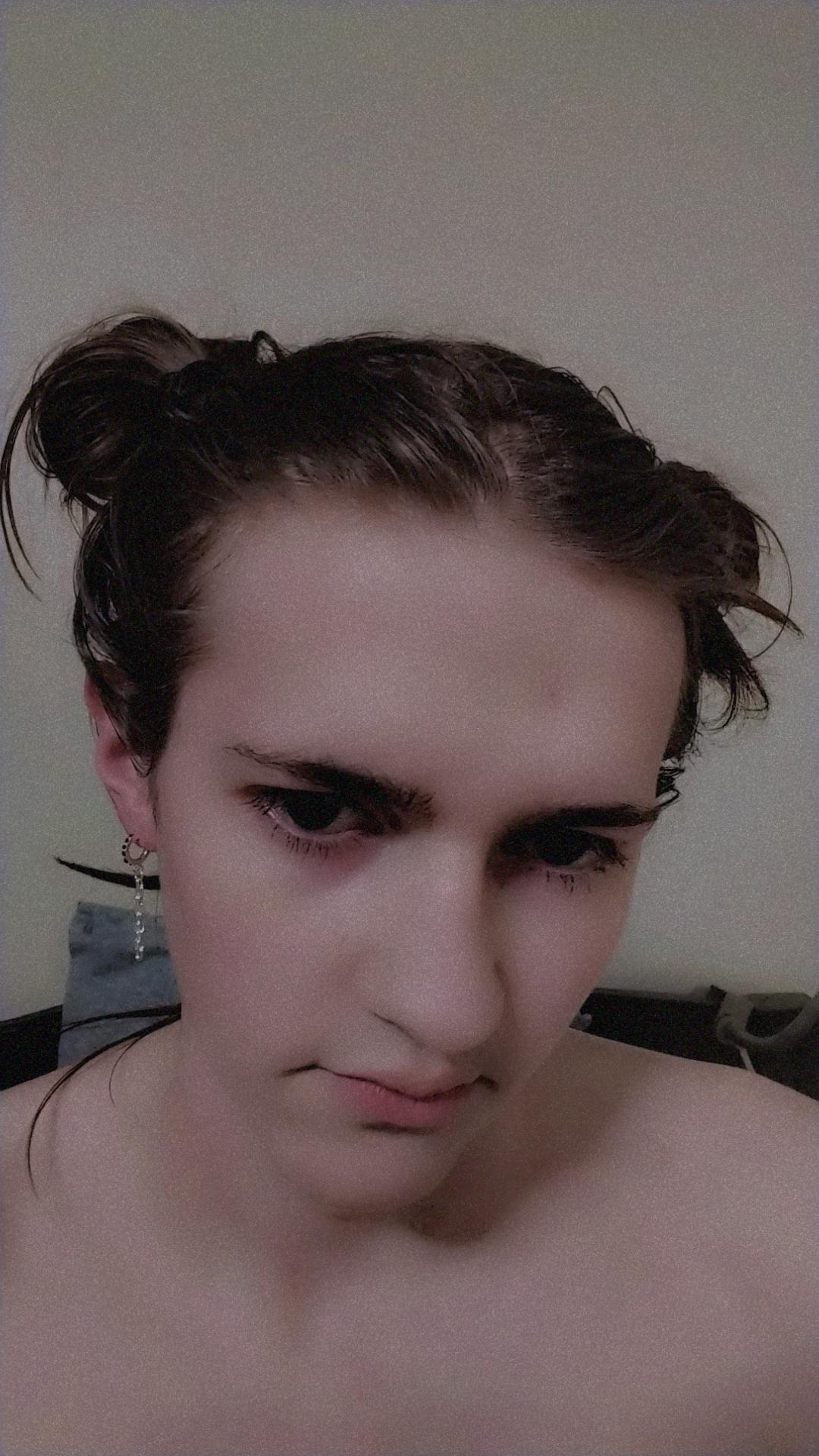 Slim white femboy with brown hair and earrings posing in white cotton panties and naked