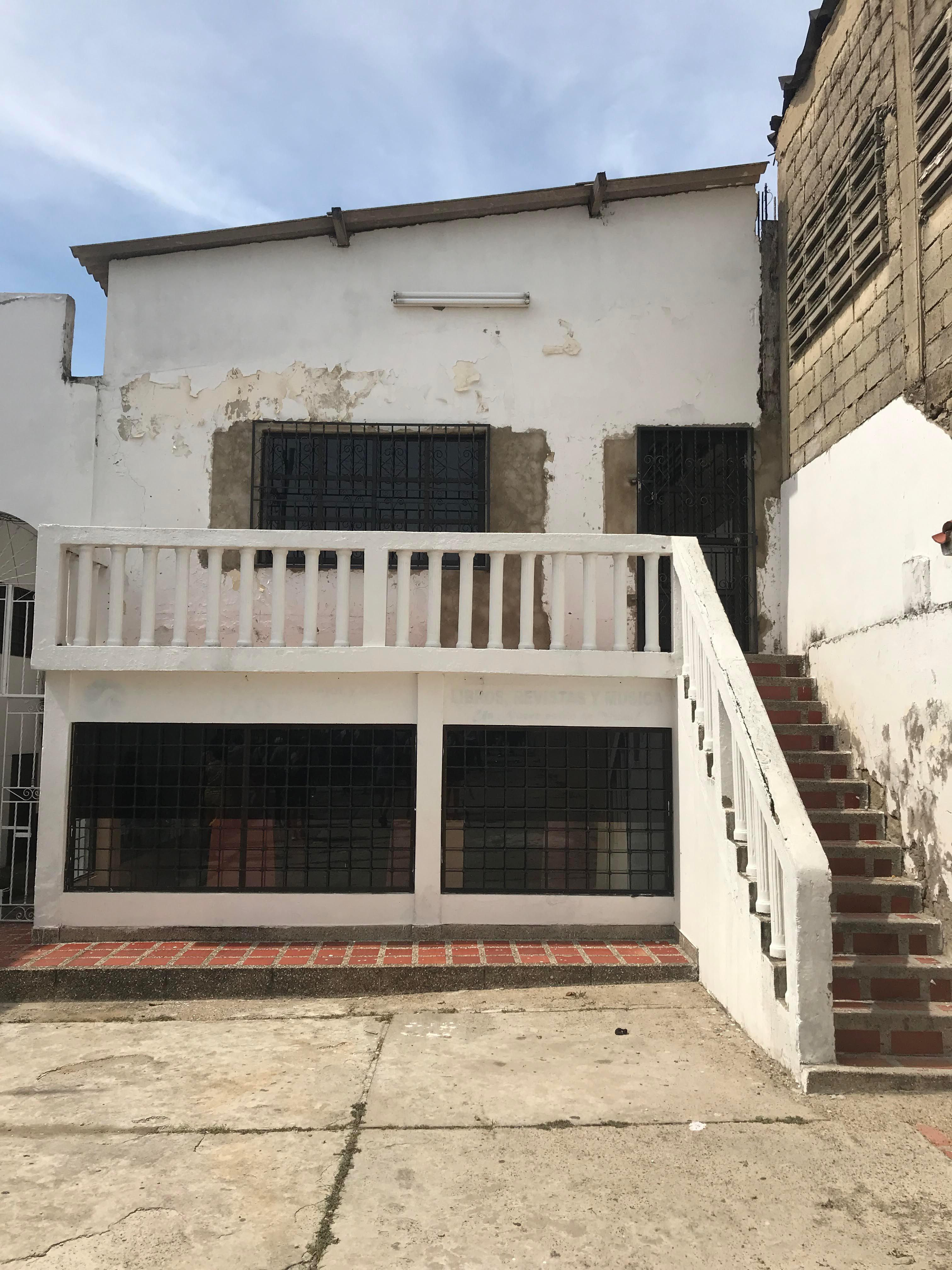 Caribbean coastal town in Colombia featuring beaches, city walls, a church, and night street views