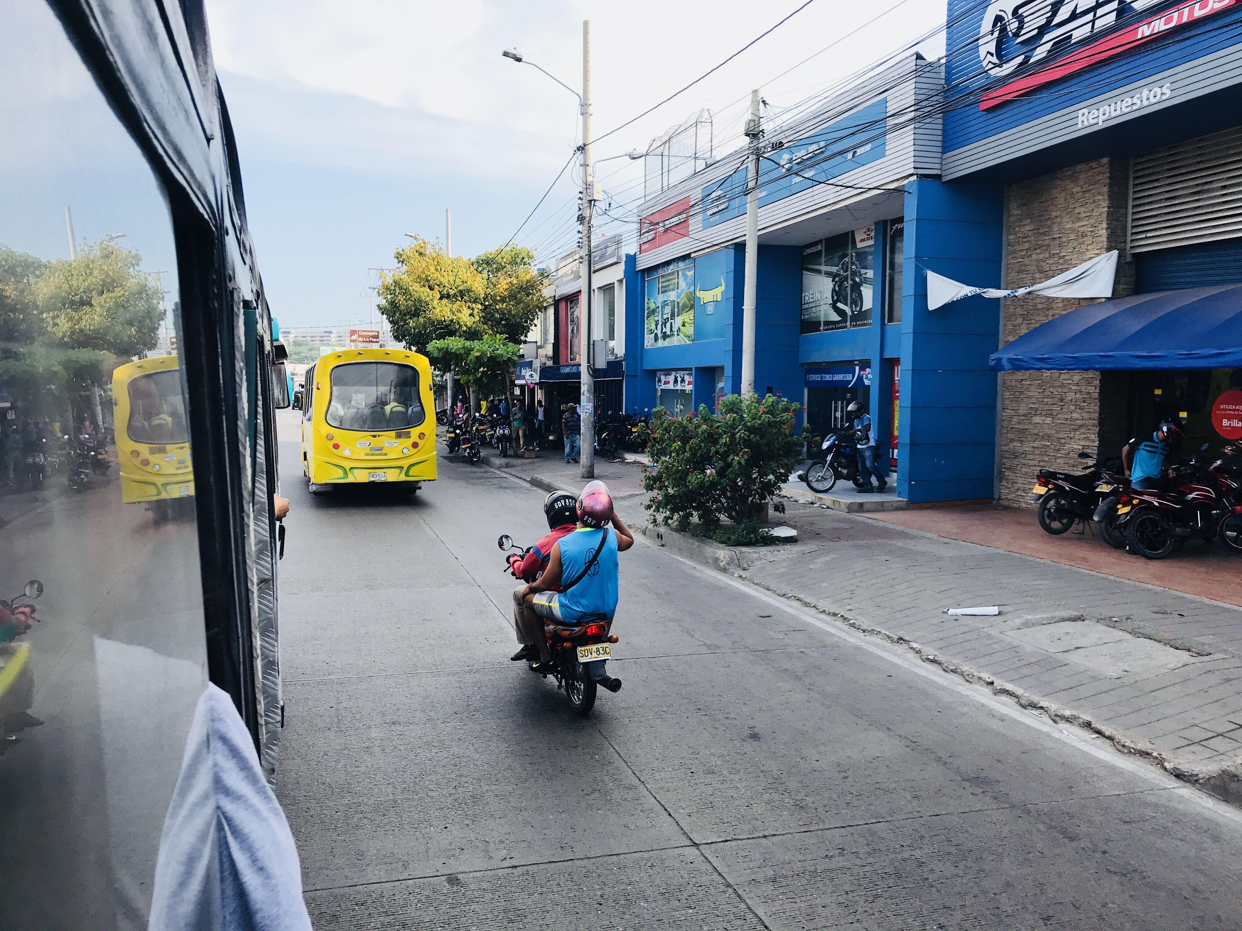 Caribbean coastal town in Colombia featuring beaches, city walls, a church, and night street views