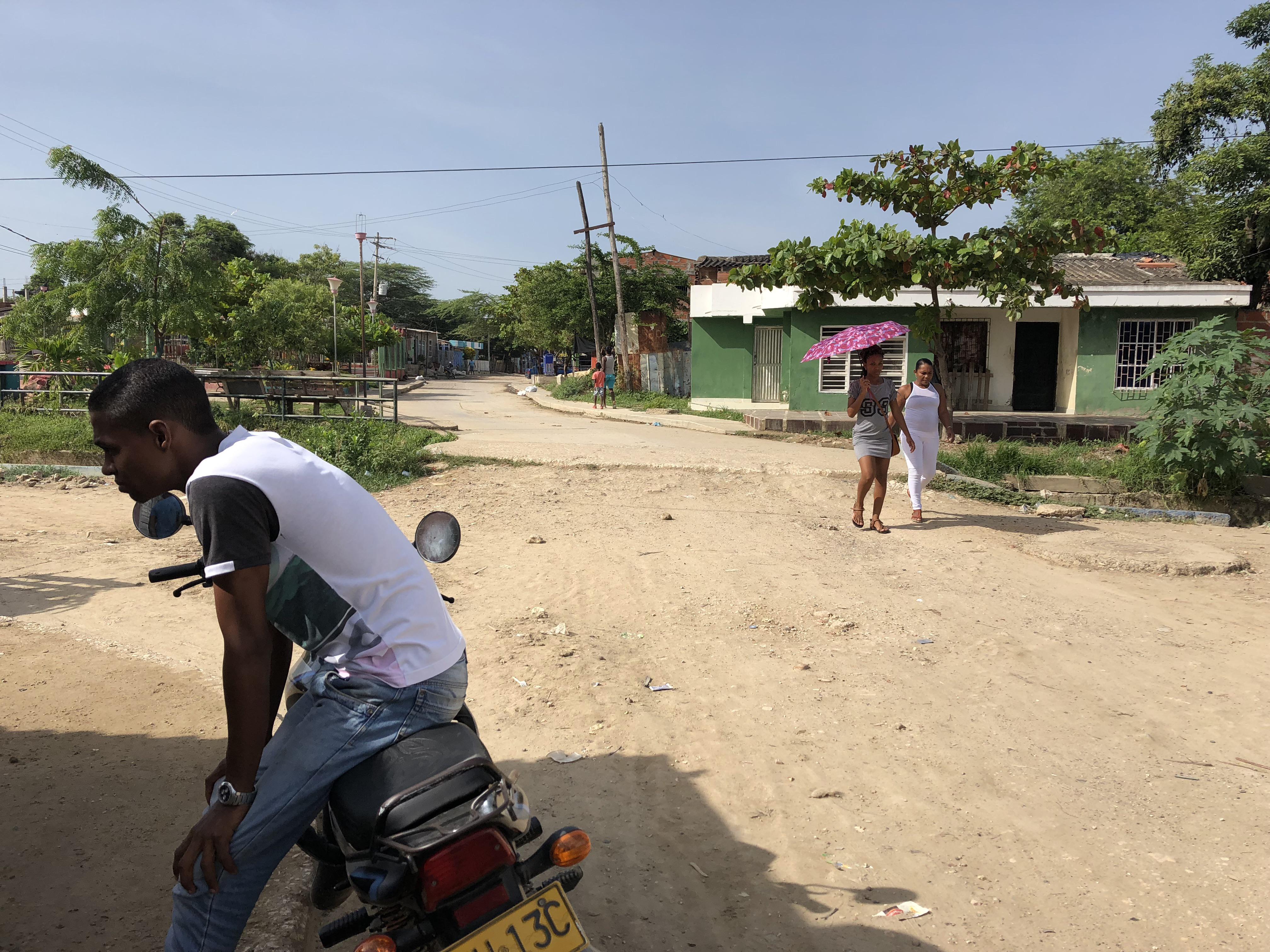 Caribbean coastal town in Colombia featuring beaches, city walls, a church, and night street views