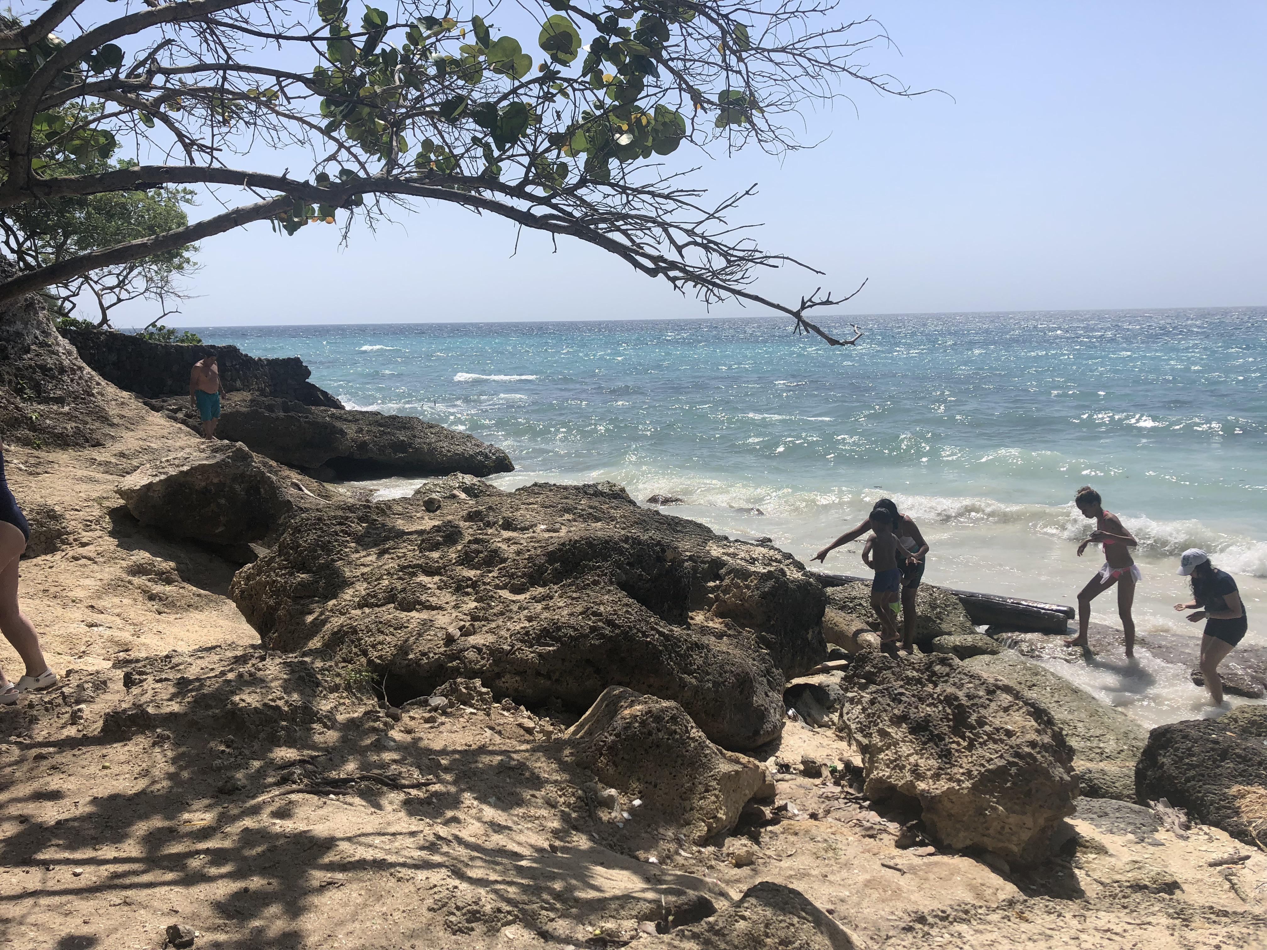 Caribbean coastal town in Colombia featuring beaches, city walls, a church, and night street views