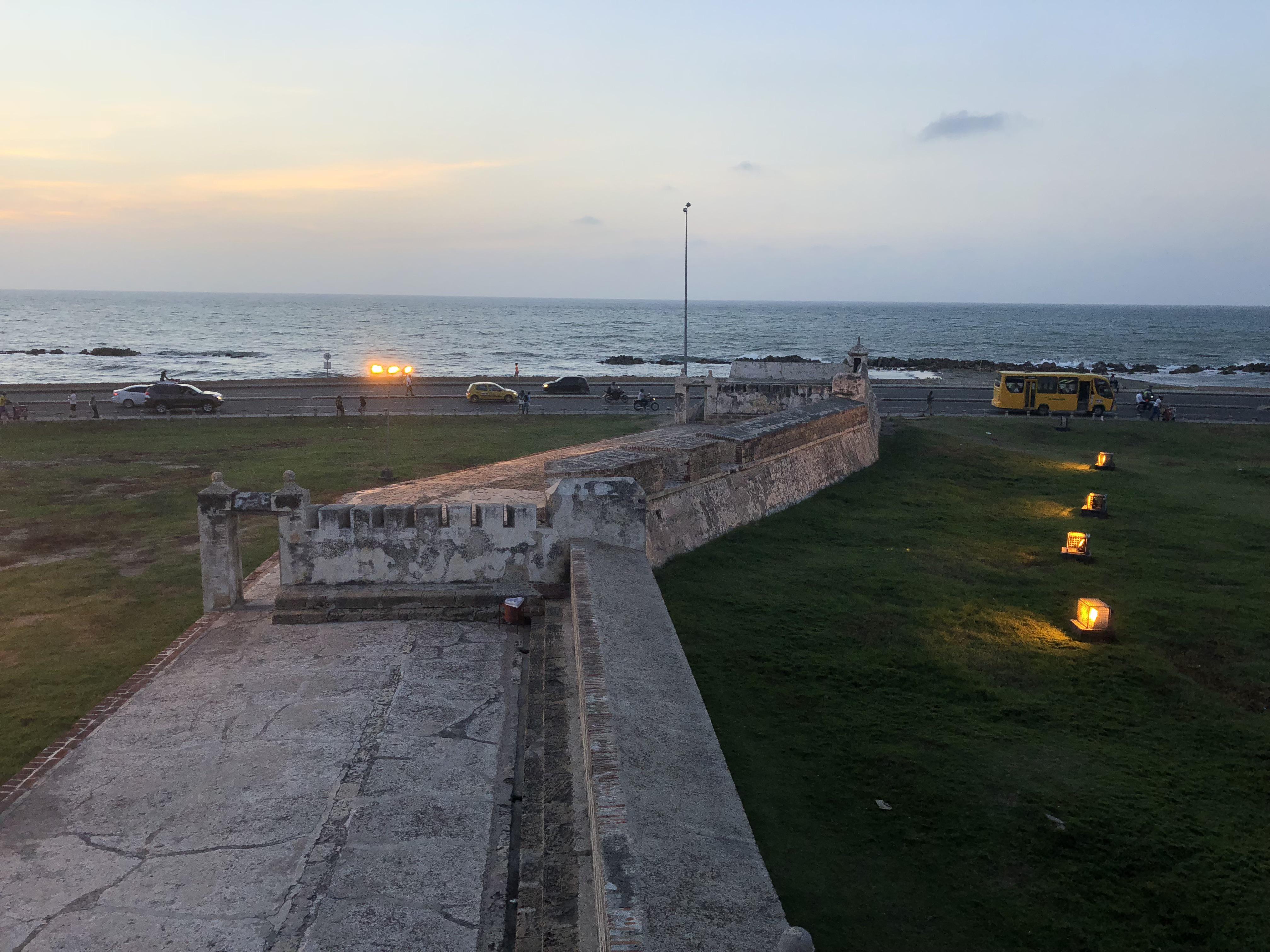 Caribbean coastal town in Colombia featuring beaches, city walls, a church, and night street views