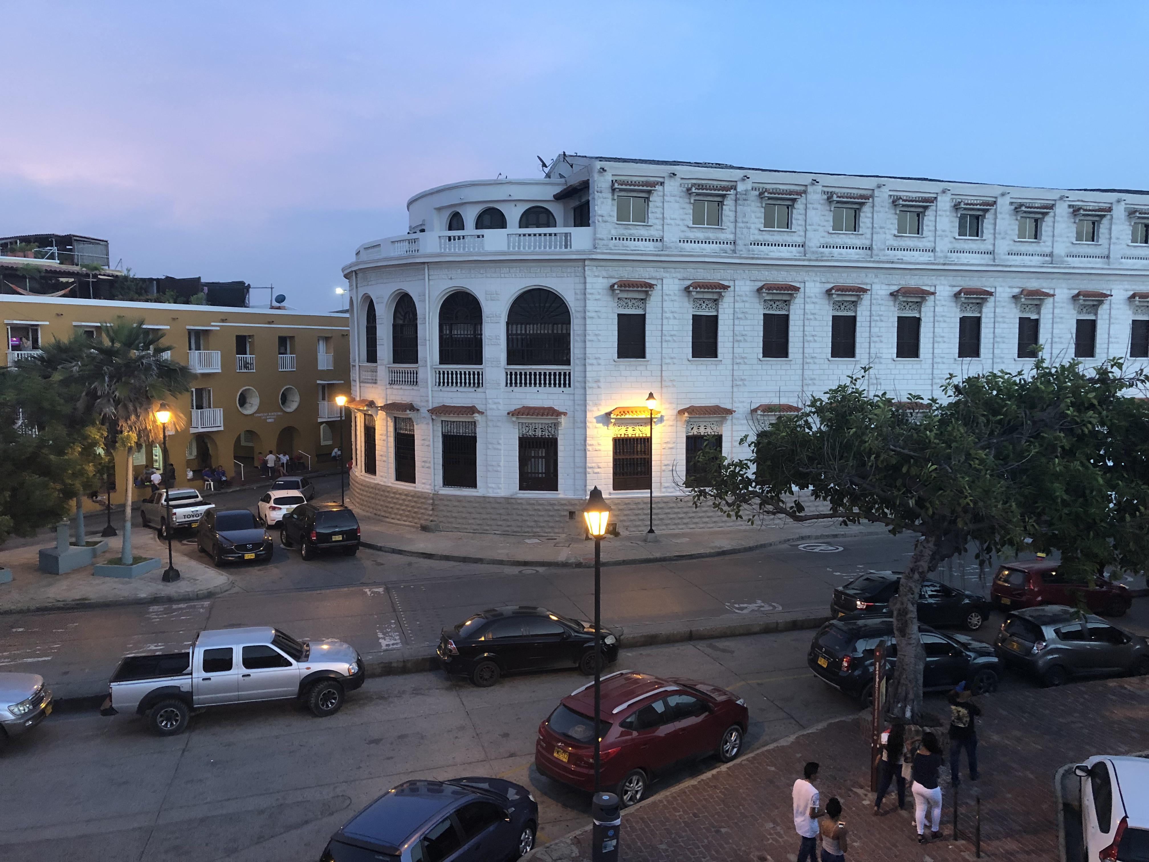Caribbean coastal town in Colombia featuring beaches, city walls, a church, and night street views