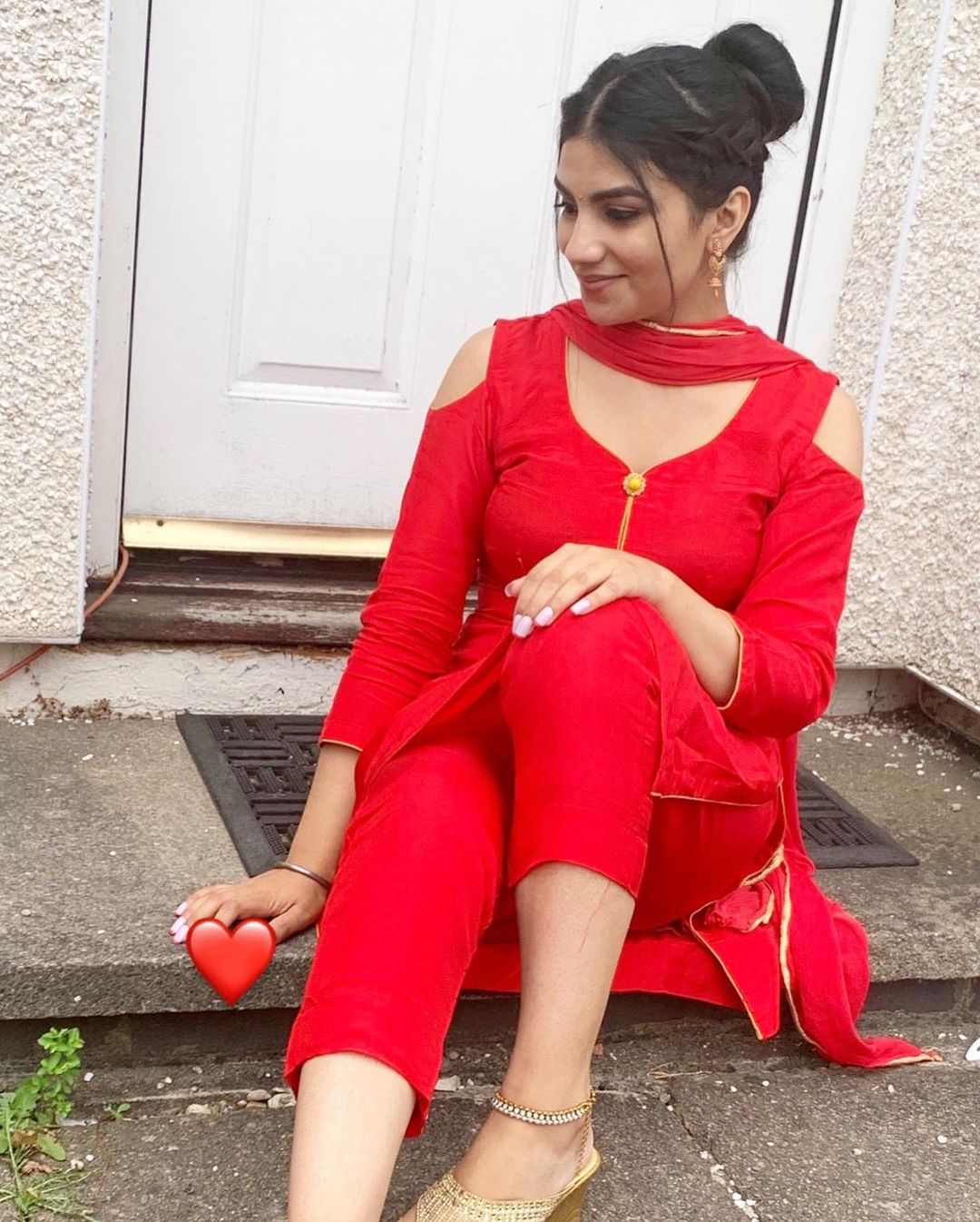 British Indian Beauty in Red Scrolller