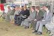 Magaziner (Seated in the front row, eighth from the left) and other Rhode Island National Guard and political leaders attending a ground breaking ceremony for the new simulator facility to be located at the 143d Airlift Wing, Quonset Air National Guard Base, North Kingstown, RI.