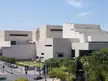 Queensland Performing Arts Centre, a modern concrete building with a tiered design in a beautiful city block