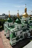 Saint Sophia Cathedral in Kiev with golden domes and green roofs under a blue sky