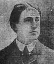 Kerrigan in a black and white vintage photo, wearing a suit and tie with dark hair.