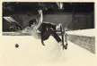 Dave performing "The Hackett Slash" skateboarding move in a black and white photo inside an empty swimming pool