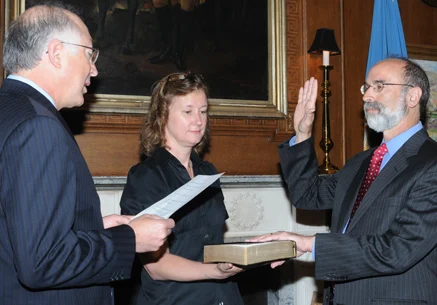 Bromwich (right) sworn in by Secretary of the Interior Ken Salazar as Director of the Bureau of Ocean Energy Management (2010)