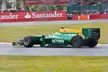 Bianchi driving a green and yellow Lotus ART Formula 1 racing car at Silverstone