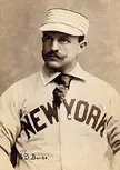 Eddie Burke in a vintage New York baseball uniform and cap