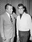 Two smiling men with dark hair in vintage fashion on the Ed Sullivan Show in 1959.