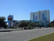 Island View's Beach Casino and Hotel complex with a sign for sports books under a clear blue sky