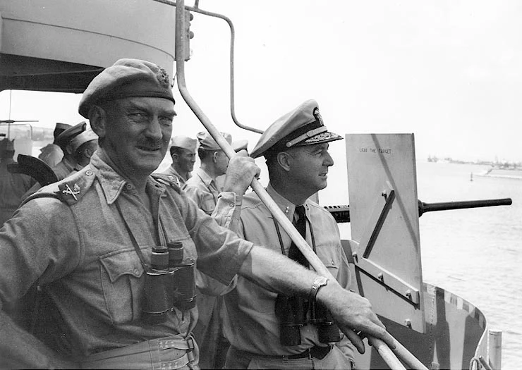 Rear Admiral Richard L. Conolly, pictured here on the right, alongside British Major General J. L. I. Hawkesworth aboard USS Biscayne, 6 September 1943.
