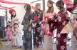 Women and girls in floral print kimonos and obi sashes at the Brighton Japan Festival Matsuri