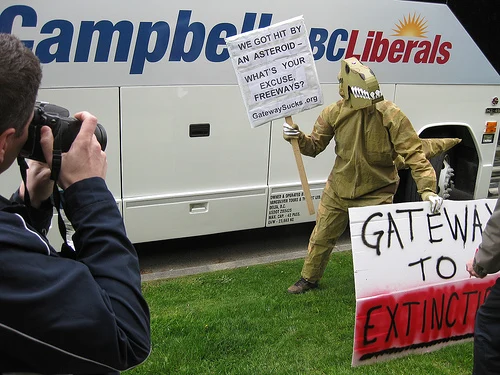 Dinosaurs protest road to extinction!