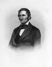 William Alcott in a black and white gravure portrait wearing a dark jacket and bowtie.