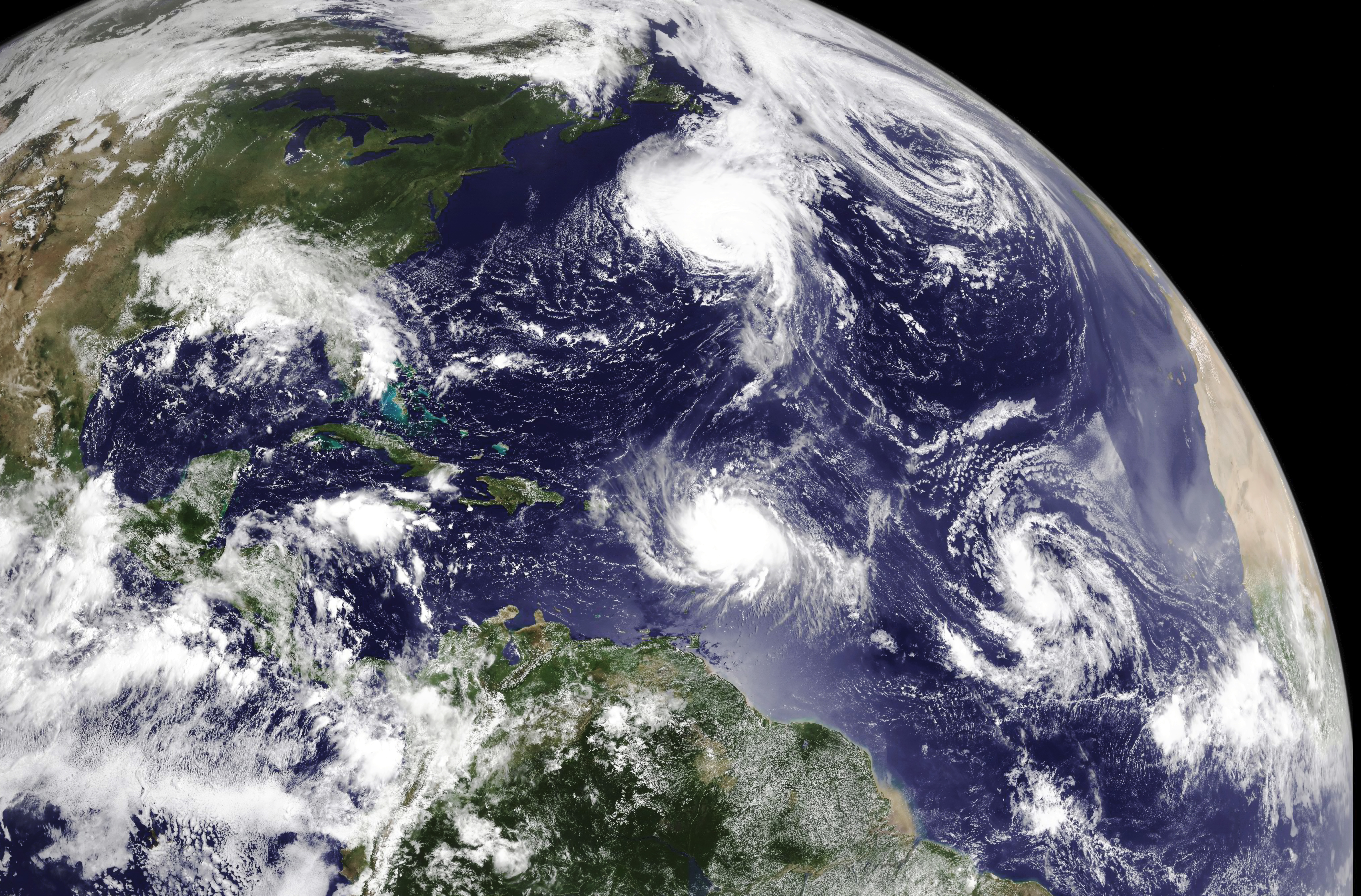 Satellite image of the North Atlantic Ocean on August 29 depicting hurricanes Danielle (top) and Earl (middle) as well as two tropical waves that would eventually develop into tropical storms Fiona and Gaston (right)