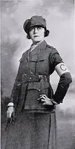 Frances Marion in a vintage black and white war correspondent uniform with a cap and armband