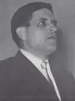 Black and white vintage photo of a man in a dark suit and white shirt from 1966