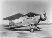 XT3D-1 US Navy biplane with one wing folded on an airfield, black and white vintage photo