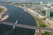 Aerial view of low water in Düsseldorf with the Rhine river, bridges, and city skyline