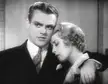 James Cagney and Joan Blondell in a black and white close-up, with Blondell leaning her head on his shoulder