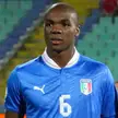 Ogbonna wearing a blue Italy national football team jersey with the number 6 in a stadium