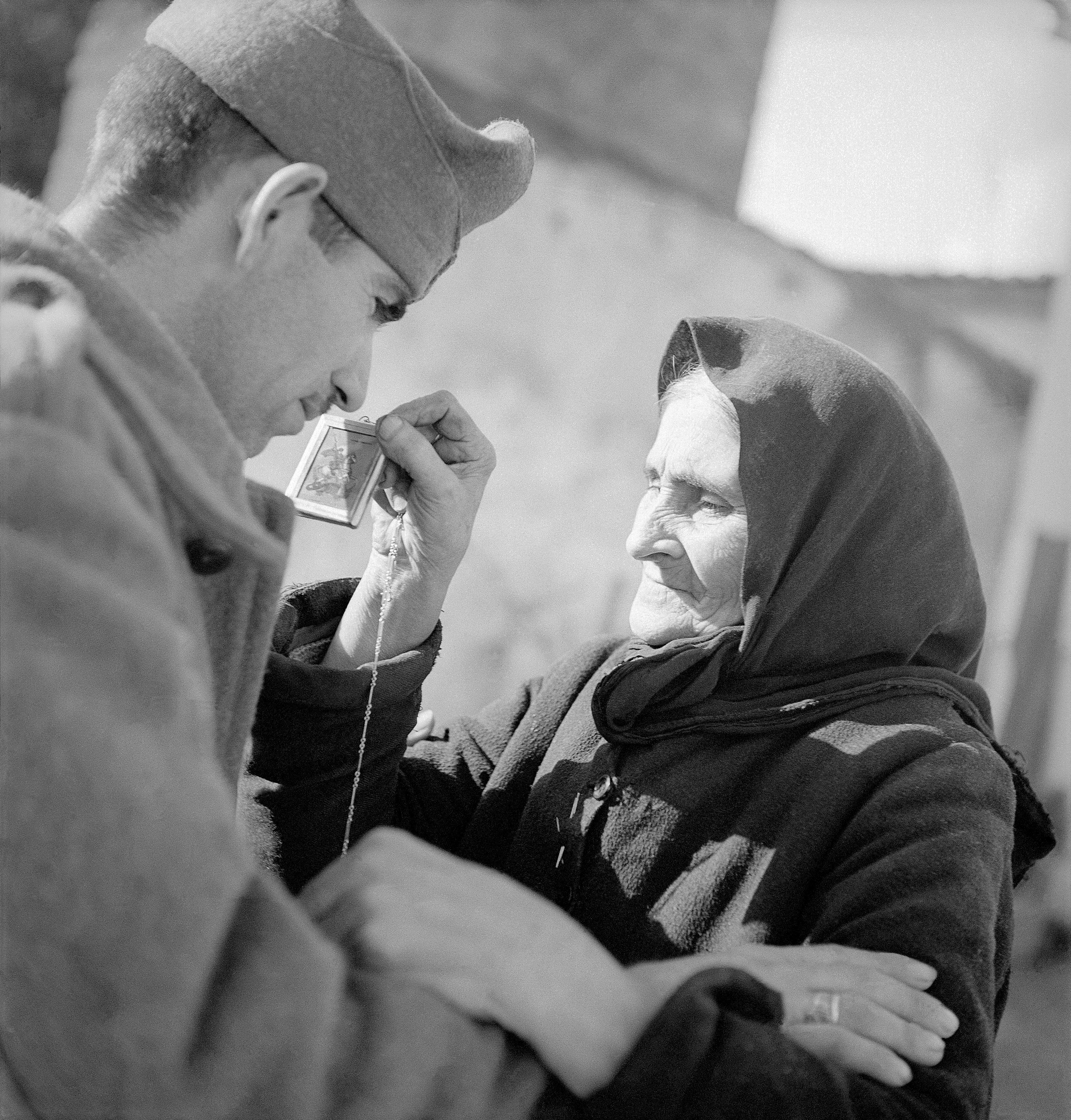 A Greek woman sees her son depart for the Albanian front.