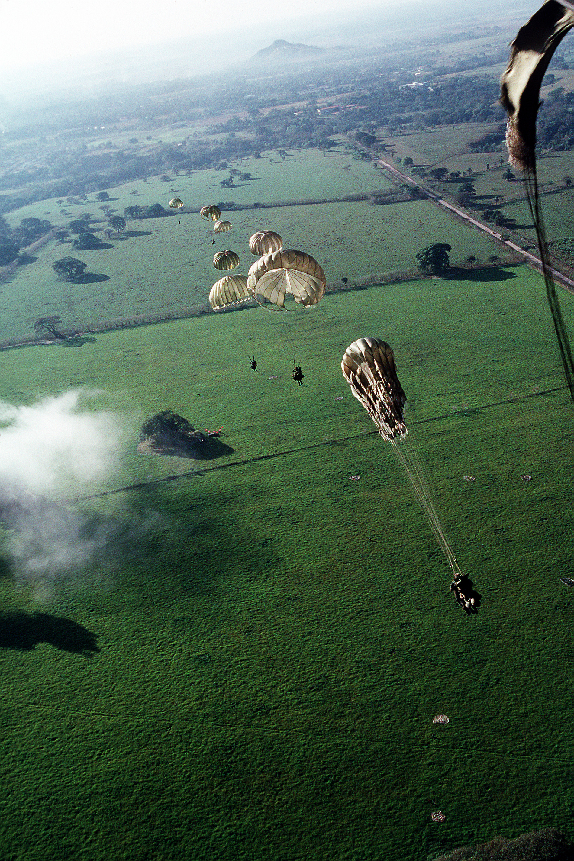 Elements of 1st Bn, 508th Infantry parachuting into a drop zone, during training, outside of Panama City.