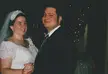 Tricia and Slush in vintage wedding photos; Tricia wears a white lace off-the-shoulder dress with a veil and tiara.