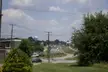 VA vintage photo of a road winding through Madison Heights toward U.S. 29 with a blue water tower and utility poles.