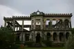 The Ruins in Talisay City, Negros Occidental: a ruined stone building with classical arches and columns.