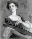 Black and white self-portrait of a woman with dark hair in a lace top holding a painter's palette and paintbrush